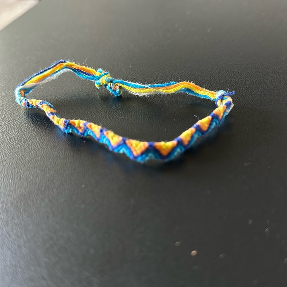 Handmade woven bracelet. Yellow, orange, navy. Triangle/chevron